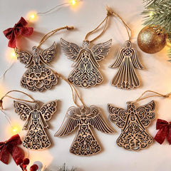 Decorative angel ornaments with intricate designs on a light background with string lights and red bows.