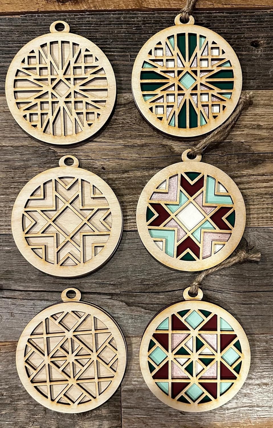 Set of geometrically designed wooden ornaments on a wooden surface