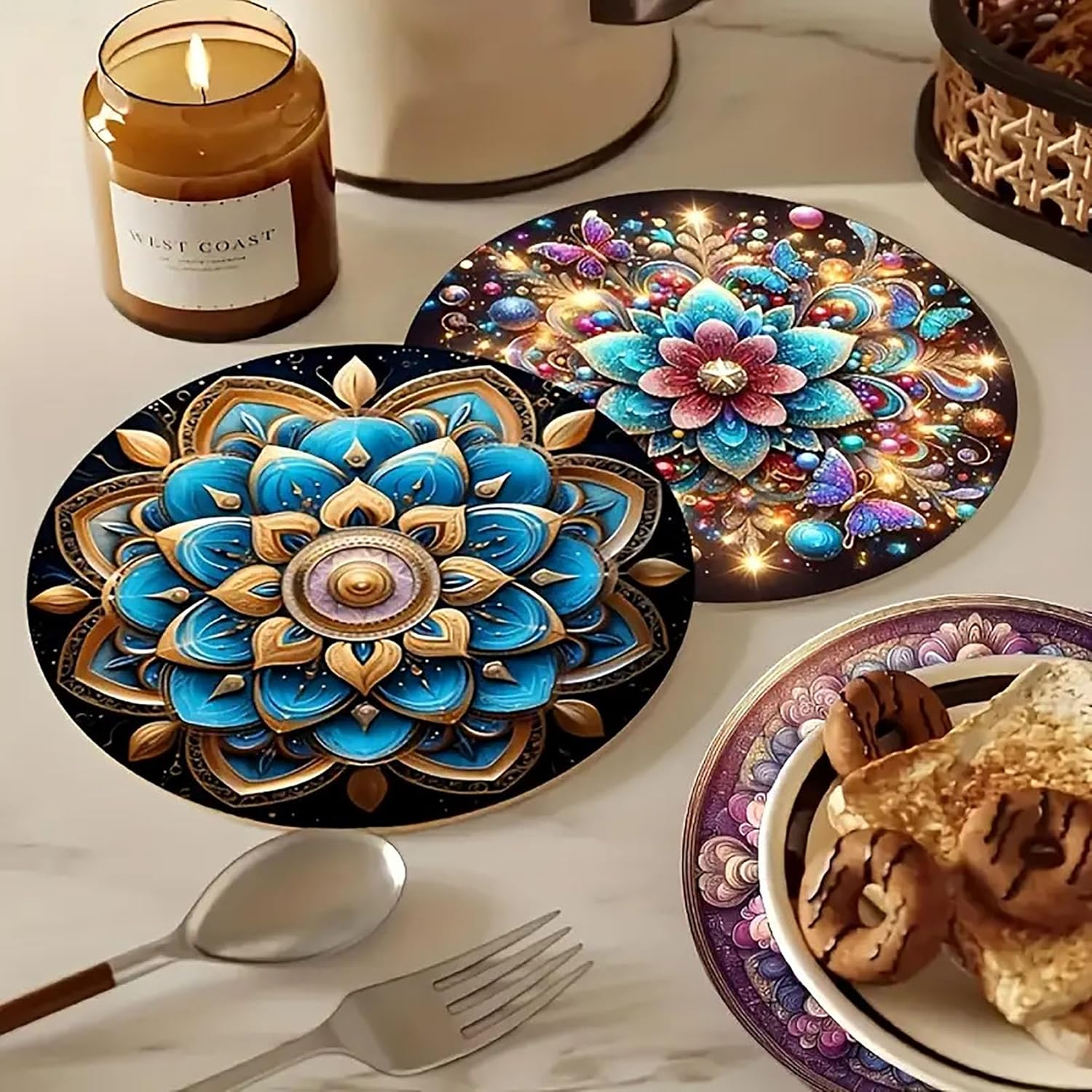 Decorative placemats with intricate designs on a table with a candle and food.