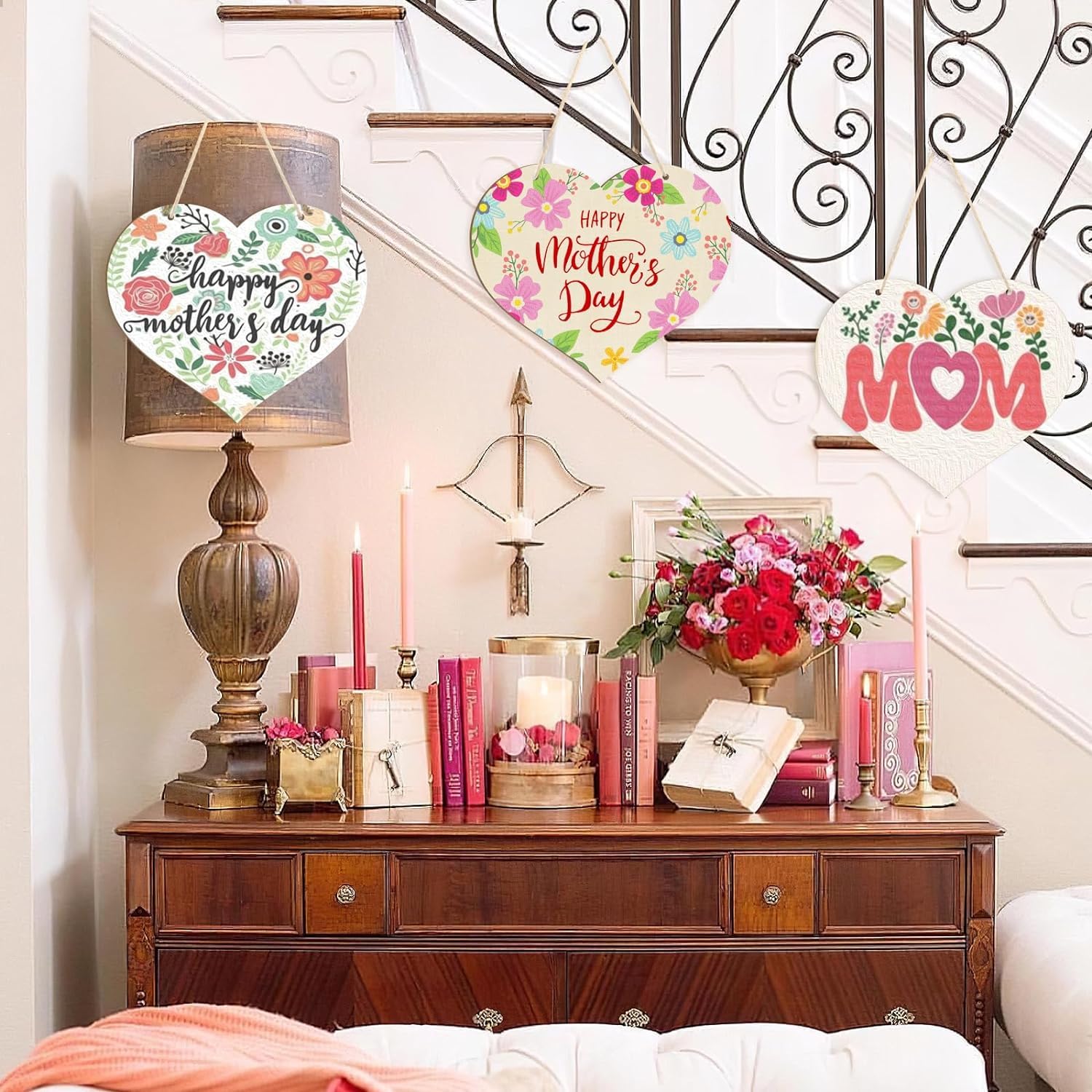 Decorative setup with 'Happy Mother's Day' and 'Mom' signs on a staircase.