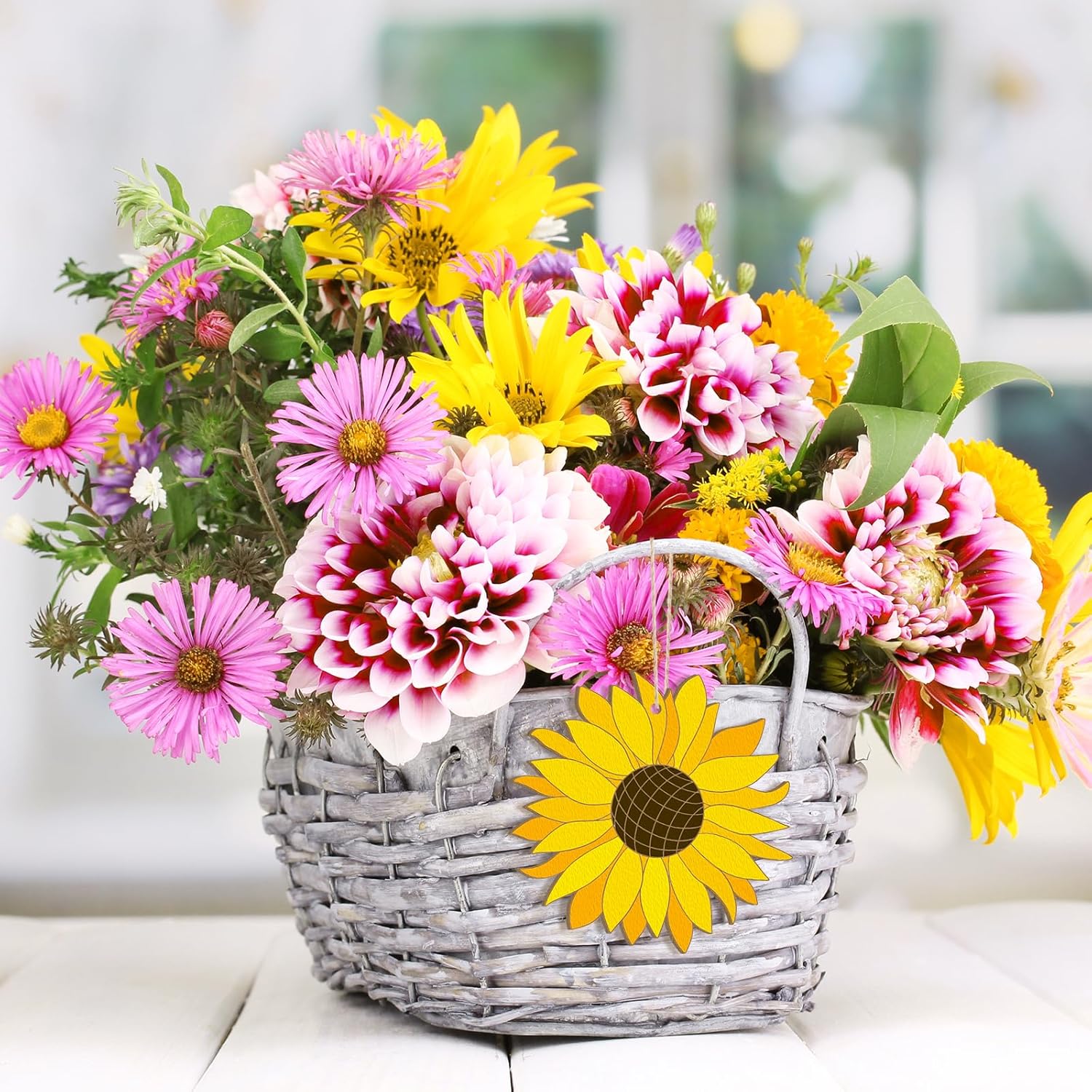 Bouquet of colorful flowers in a wicker basket with a blurred background