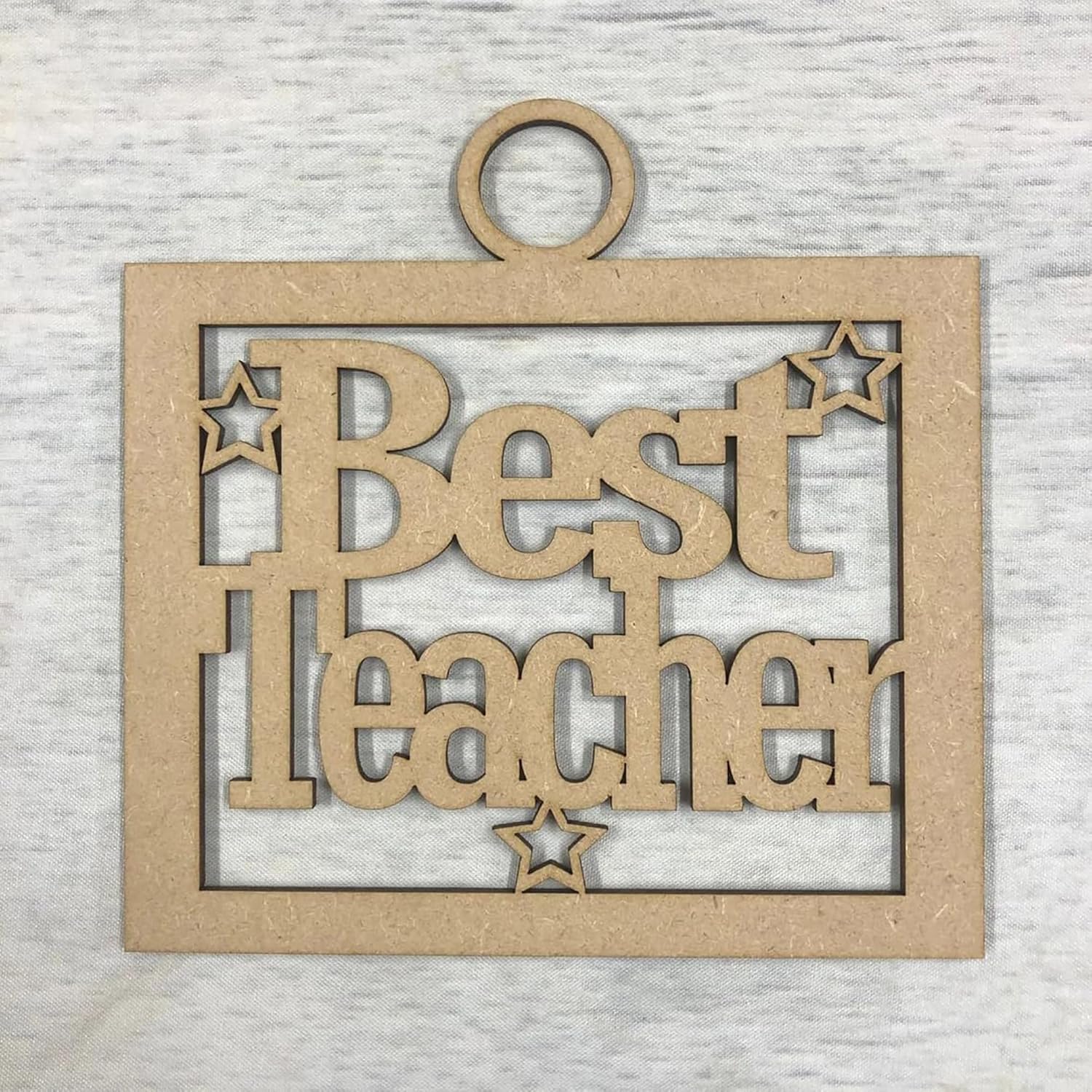 Wooden plaque with 'Best Teacher' text on a textured gray background