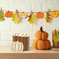 Decorative setup with pumpkins, leaves, and a stack of plates on a wooden surface against a white brick wall.