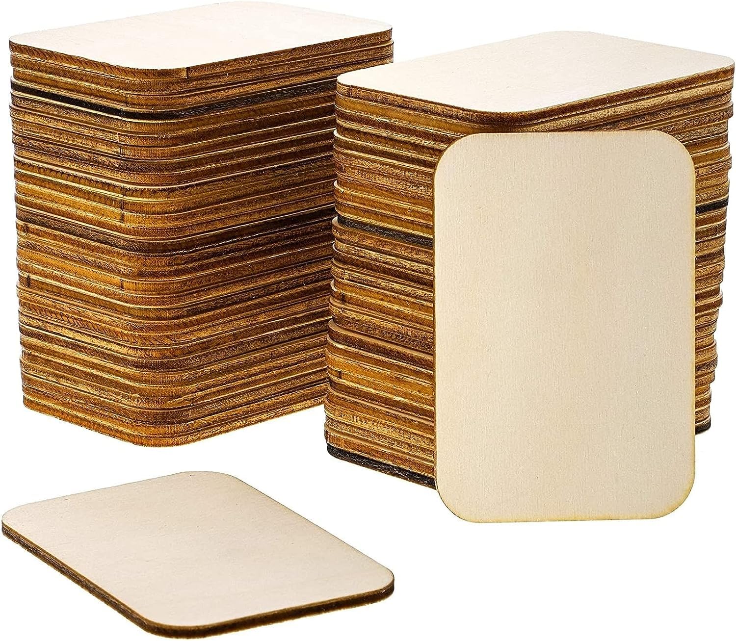 Stacks of cardboard sheets with a few cut into smaller pieces on a white background