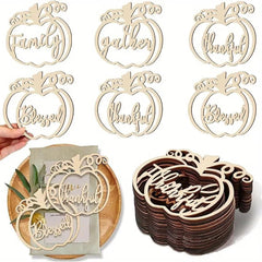 Wooden pumpkin-shaped cutouts with engraved text on a white background