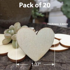 Wooden heart-shaped cutout with measurement details on a natural stone surface.