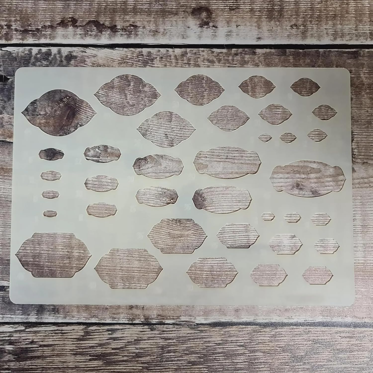 Stencil with geometric shapes on a wooden surface