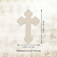 Beige cross-shaped pendant with measurements on a light wood background