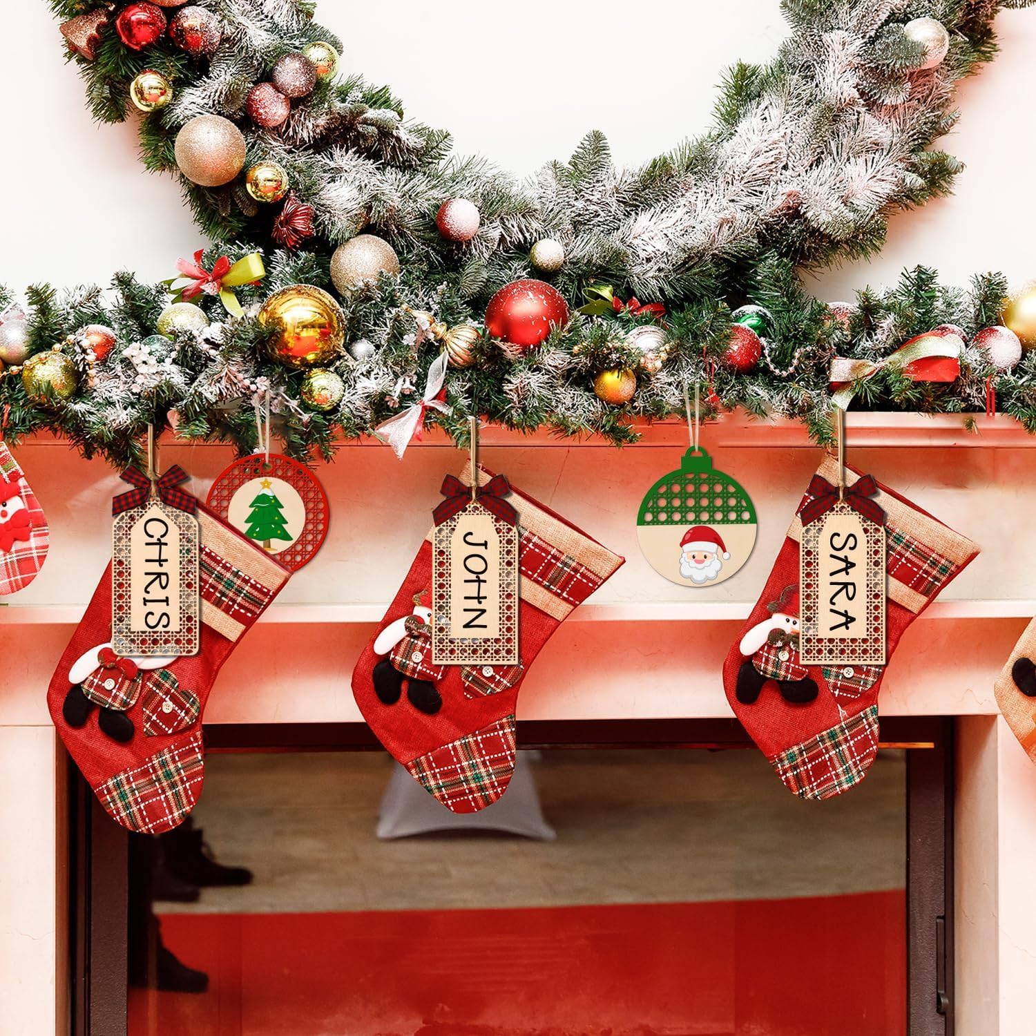 Christmas stockings with names hanging on a fireplace mantle decorated with a Christmas tree.