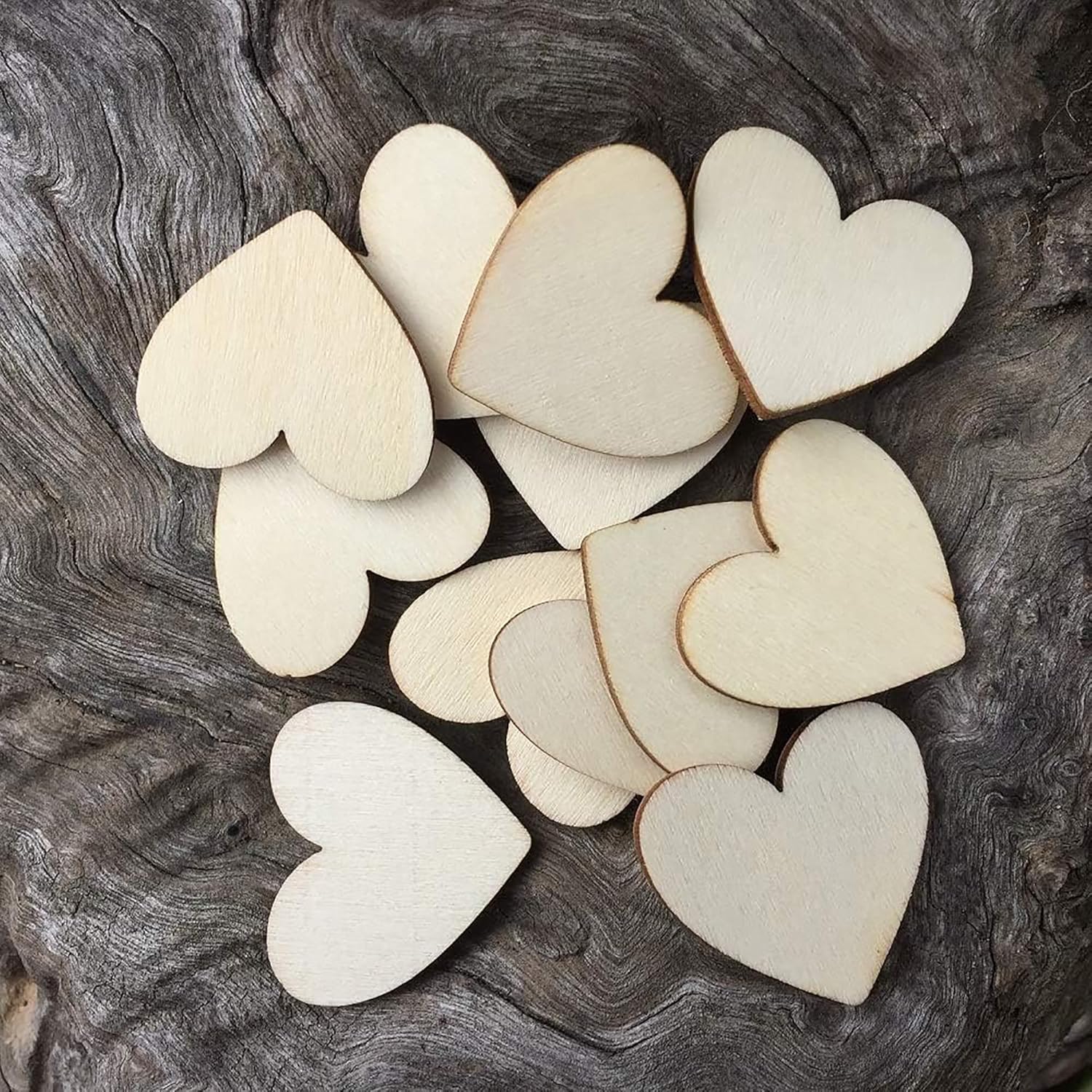 Wooden heart shapes on a textured dark surface