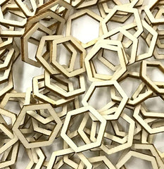 Stack of wooden hexagonal shapes on a white background