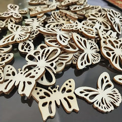Wooden butterfly decorations on a reflective surface