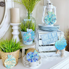 Decorative items including plants, coasters, and a sign on a shelf.