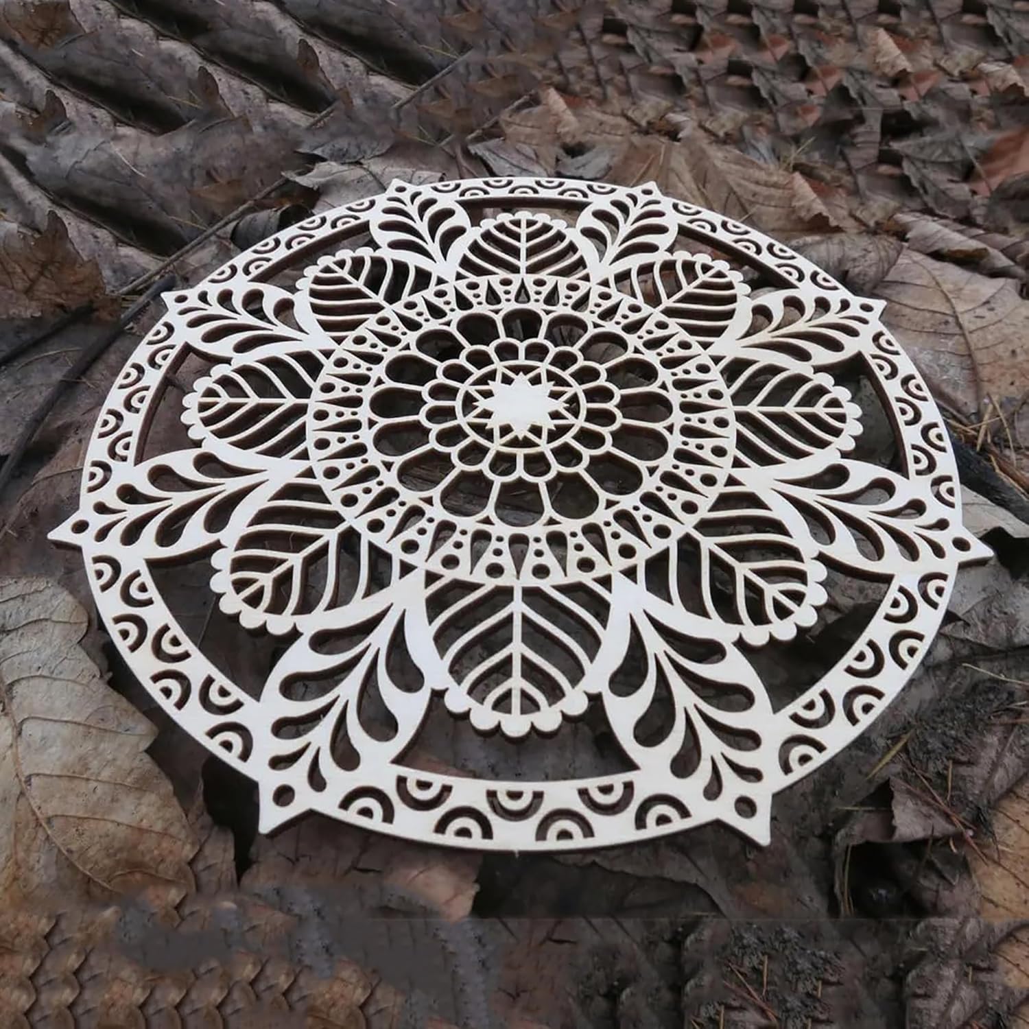 Decorative metal mandala on a textured surface