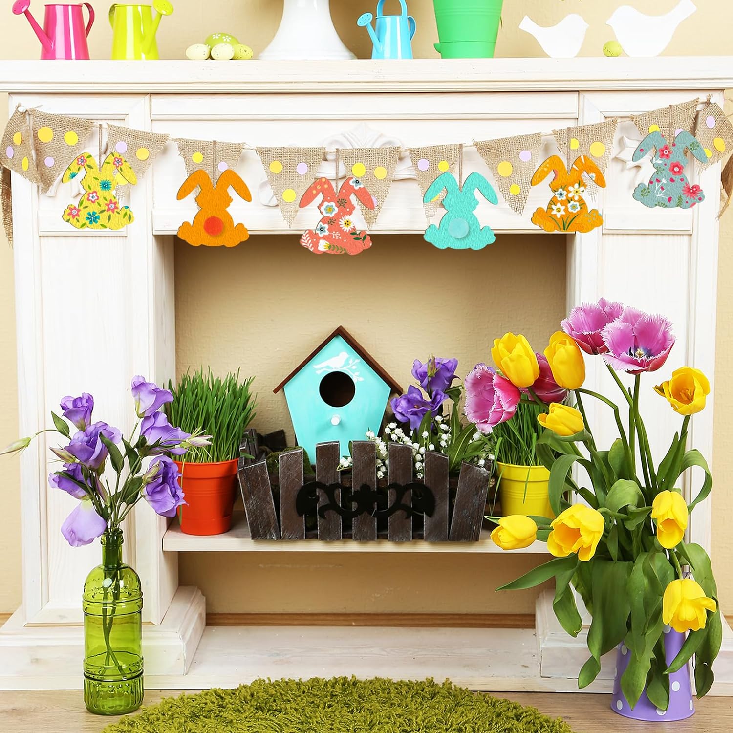 Decorative shelf with flowers, birdhouse, and bunting in a spring-themed setting.