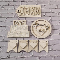 Decorative wooden signs with text and heart designs on a brick wall background