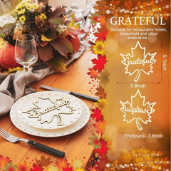 Table setting with 'Grateful' leaf-shaped cutout on a plate, surrounded by autumn-themed decorations.