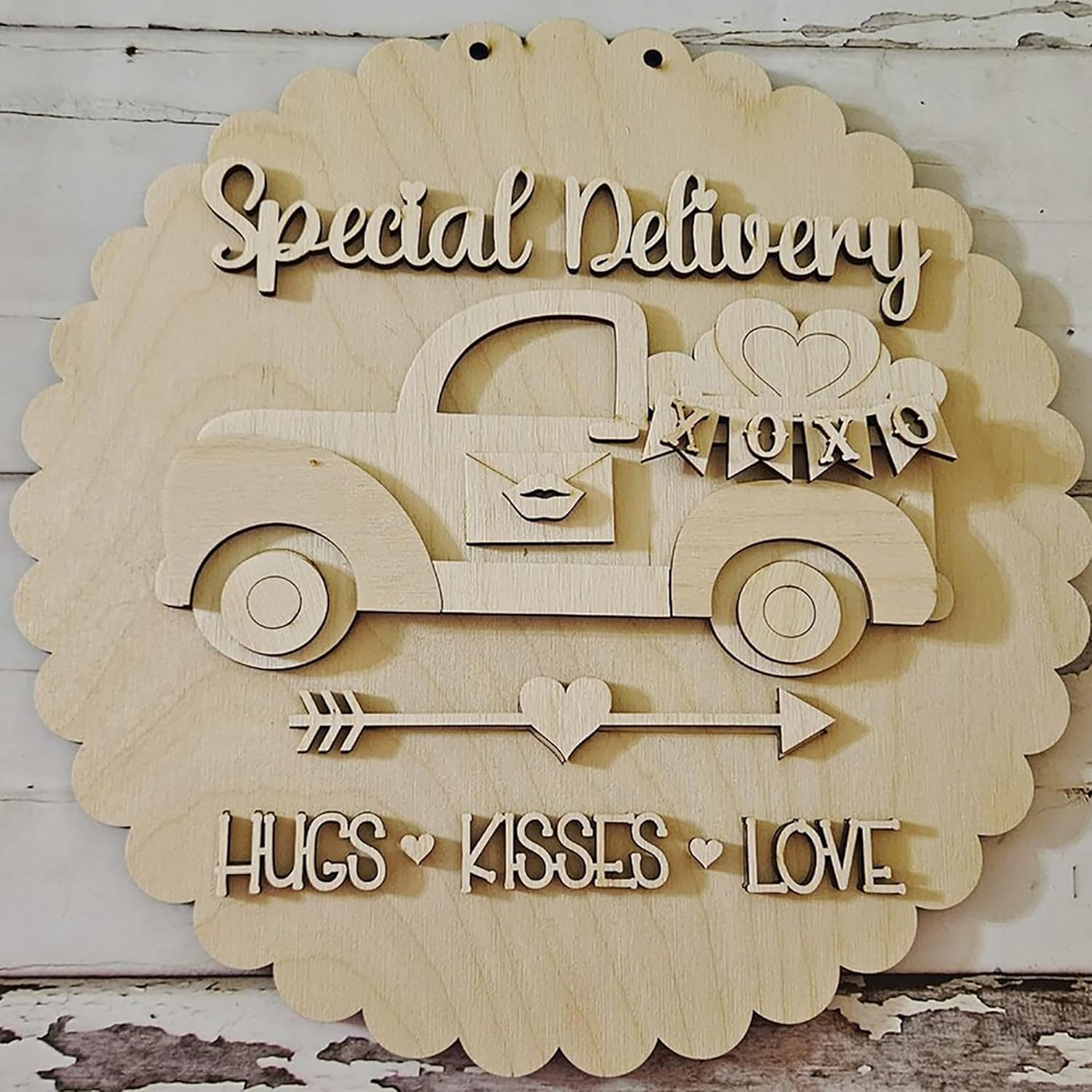 Wooden decorative sign with a truck, hearts, and text on a rustic background
