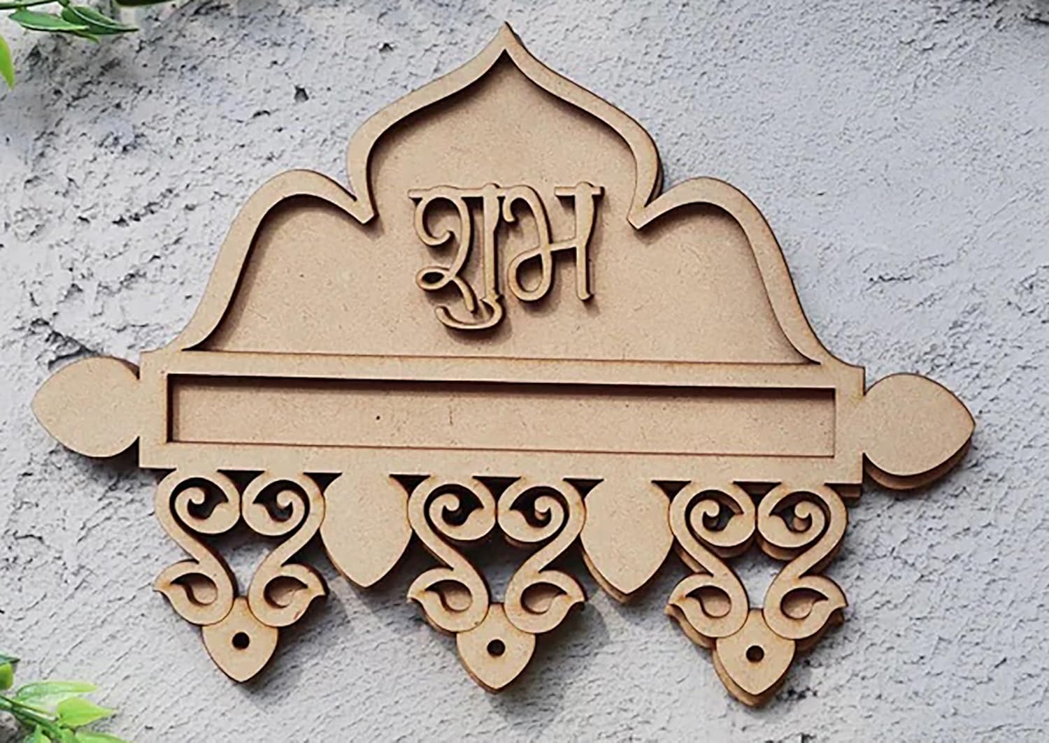 Decorative wall plaque with intricate designs and text on a light gray background
