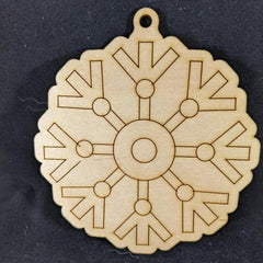 Wooden snowflake ornament on a black background