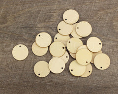 Wooden tags scattered on a wooden surface