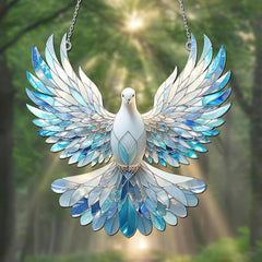Decorative glass dove with blue and white feathers against a blurred green background