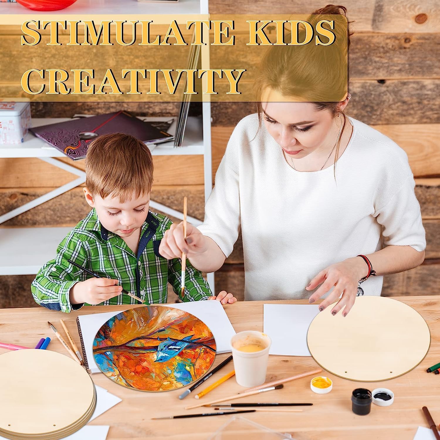 Woman and child painting together with art supplies on a wooden table.