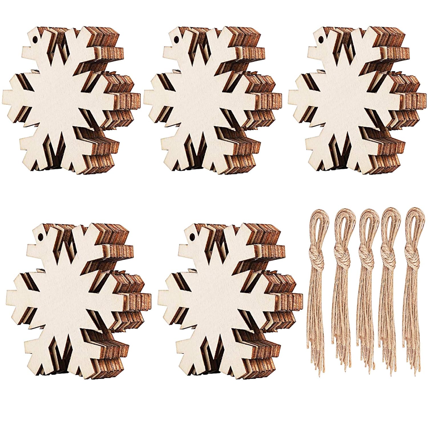 Set of wooden snowflake ornaments with string attachments on a white background