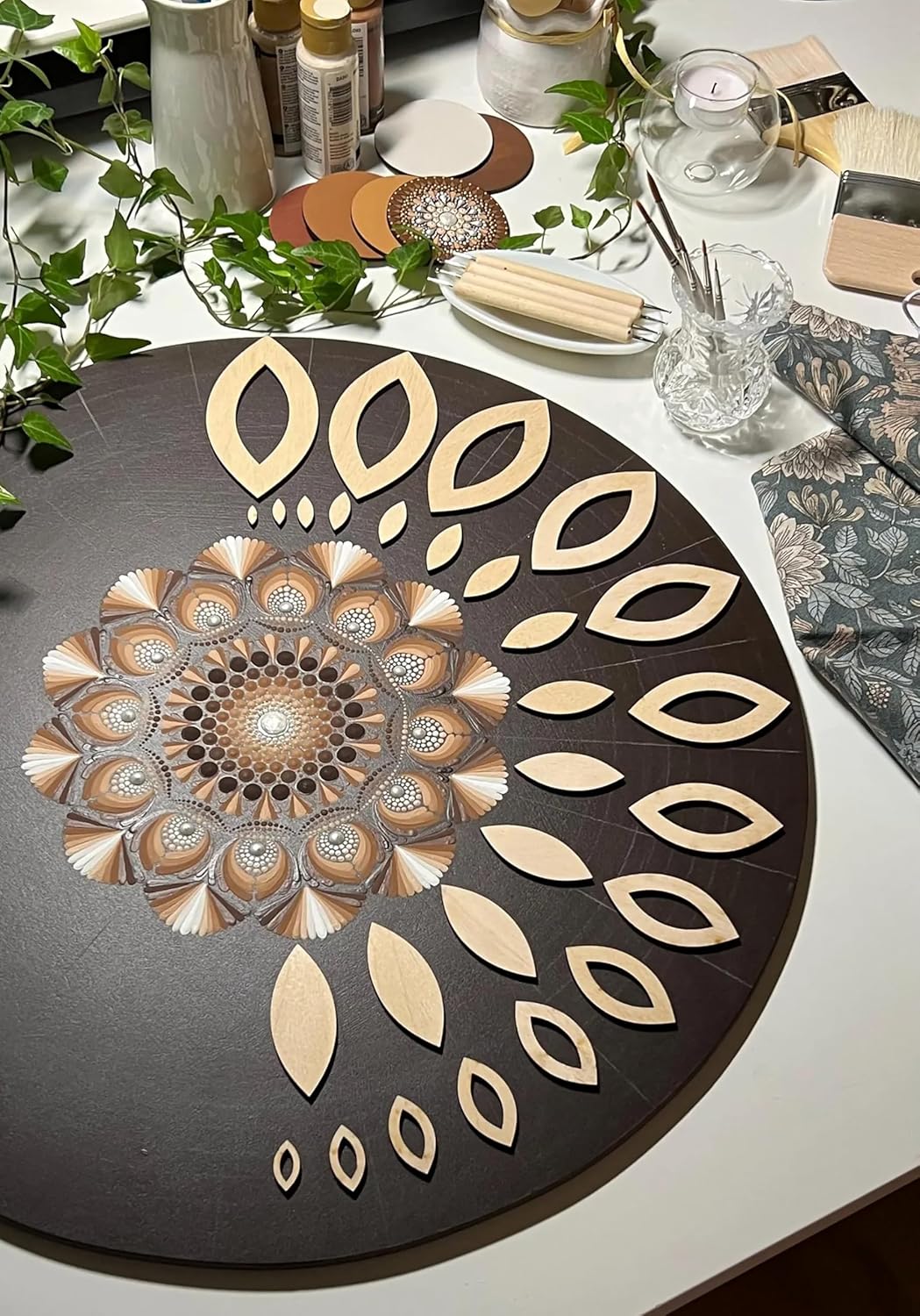 Decorative round mat with leaf pattern on a table setting