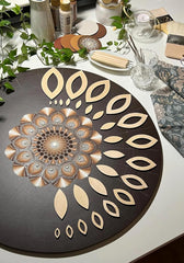 Decorative round mat with leaf pattern on a table setting