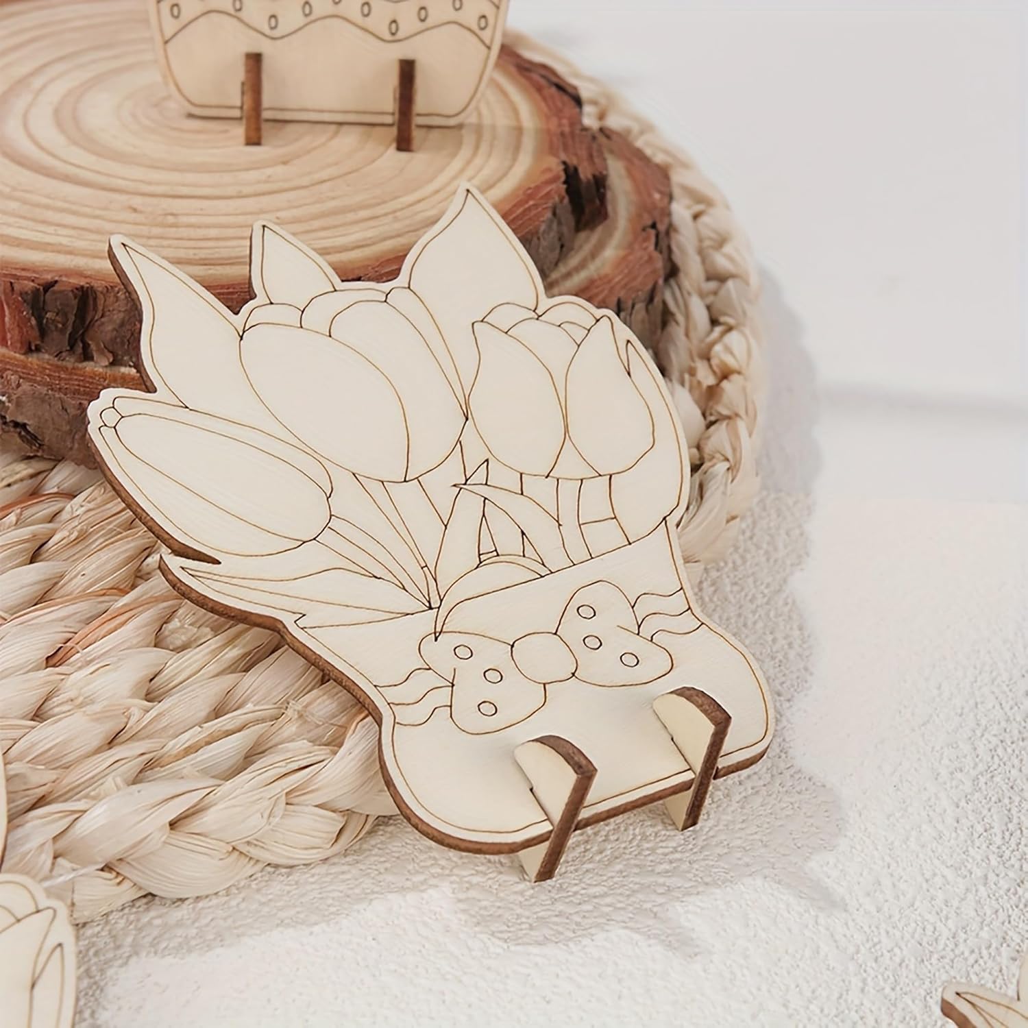 Wooden tulip-shaped ornament on a woven surface