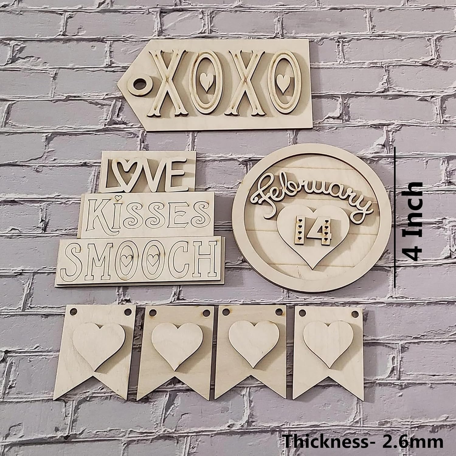 Wooden decorative signs with text and hearts on a gray brick wall background