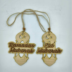 Two wooden hanging decorations with 'Ramadan Mubarak' and 'Eid Mubarak' text on a light background.