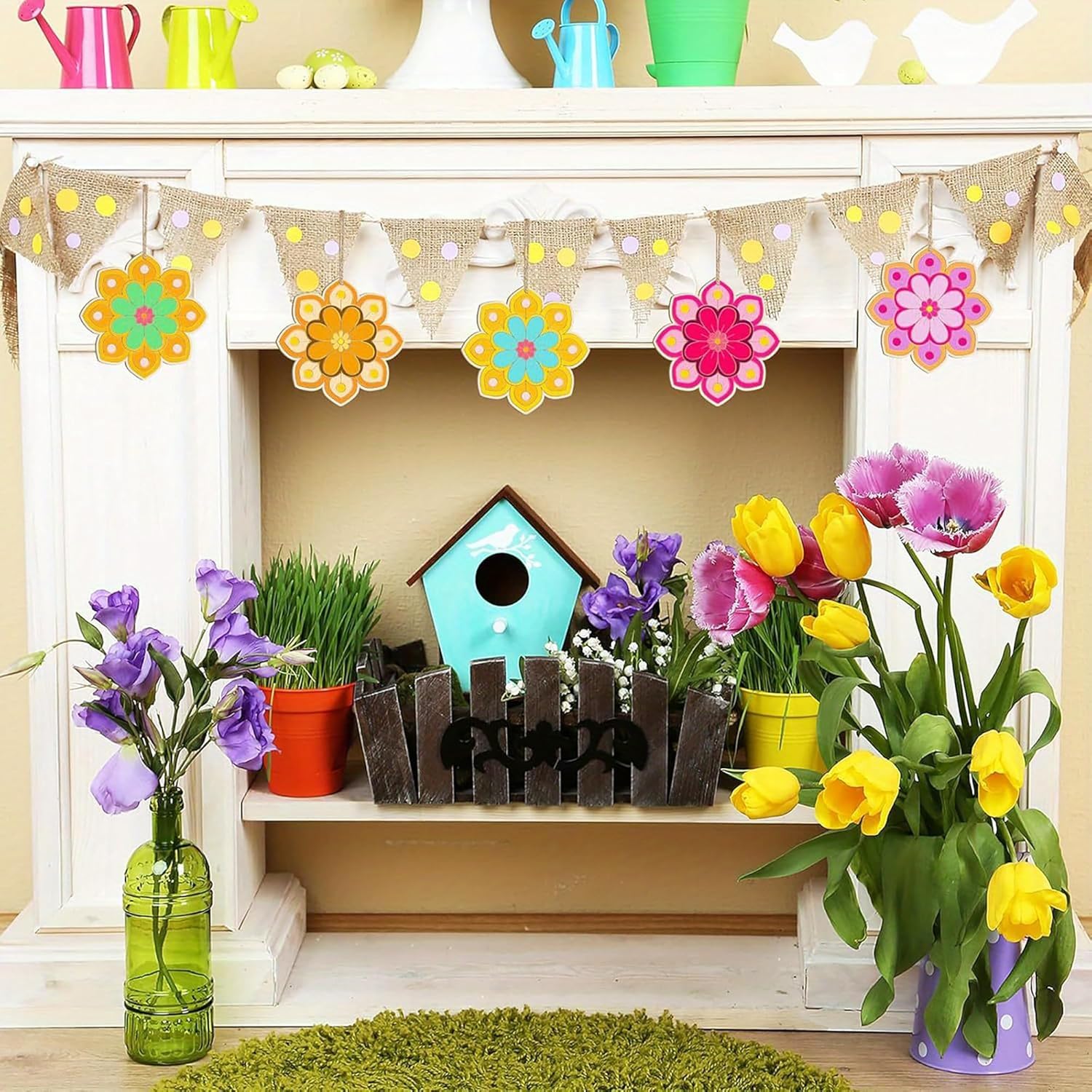 Decorative shelf with flowers, a birdhouse, and a colorful banner above.