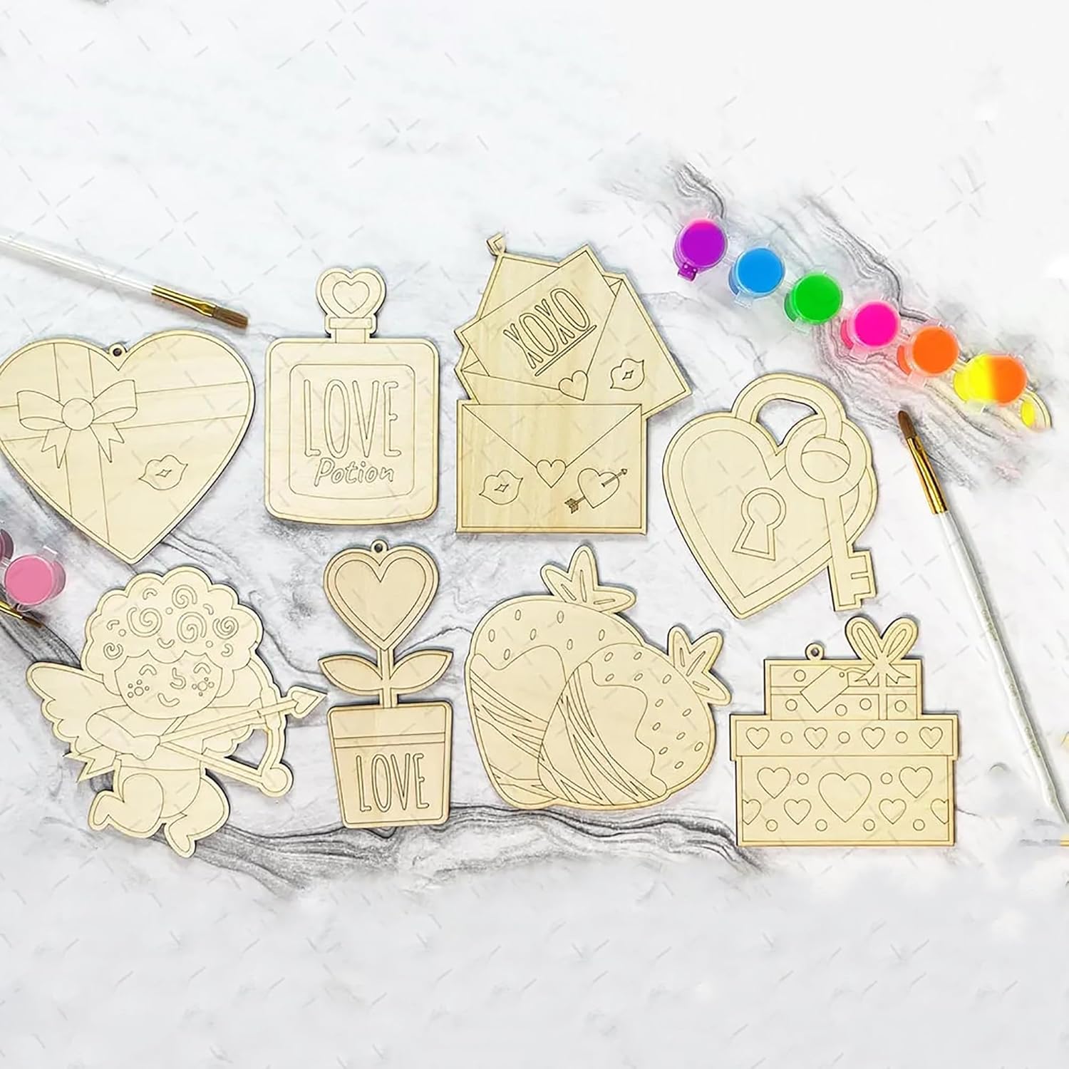 Wooden decorative elements with various designs on a white surface