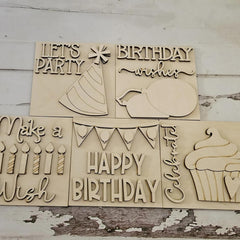 Wooden birthday-themed cutouts with text and graphics on a rustic wooden background