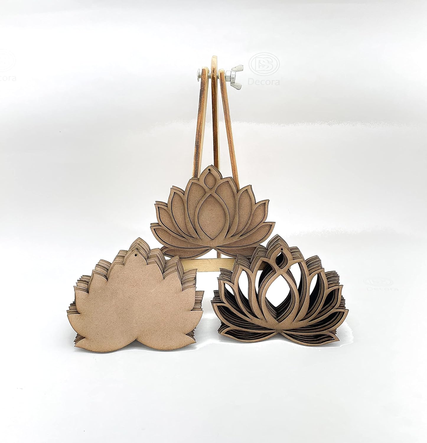Three wooden lotus flower shapes on a white background