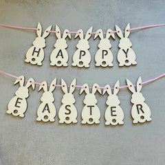Happy Easter banner with bunny shapes on a gray background