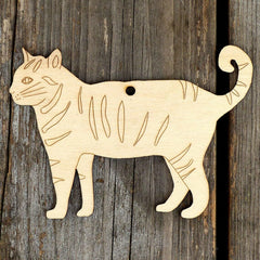 Wooden cat-shaped ornament on a wooden surface