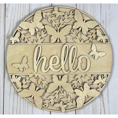 Decorative wall art with butterflies and the word 'hello' on a wooden background
