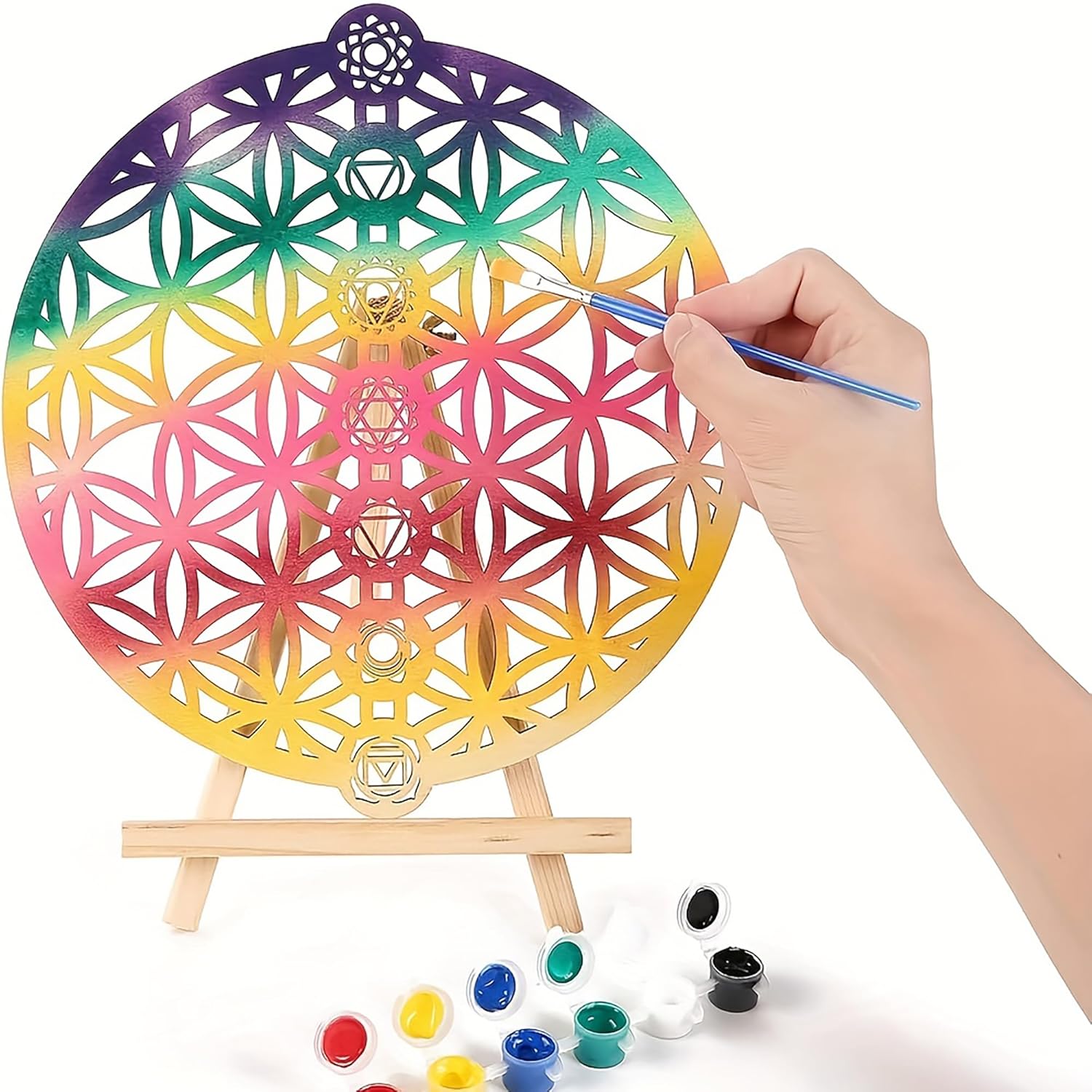 Colorful geometric art wheel with a hand painting it on a white background
