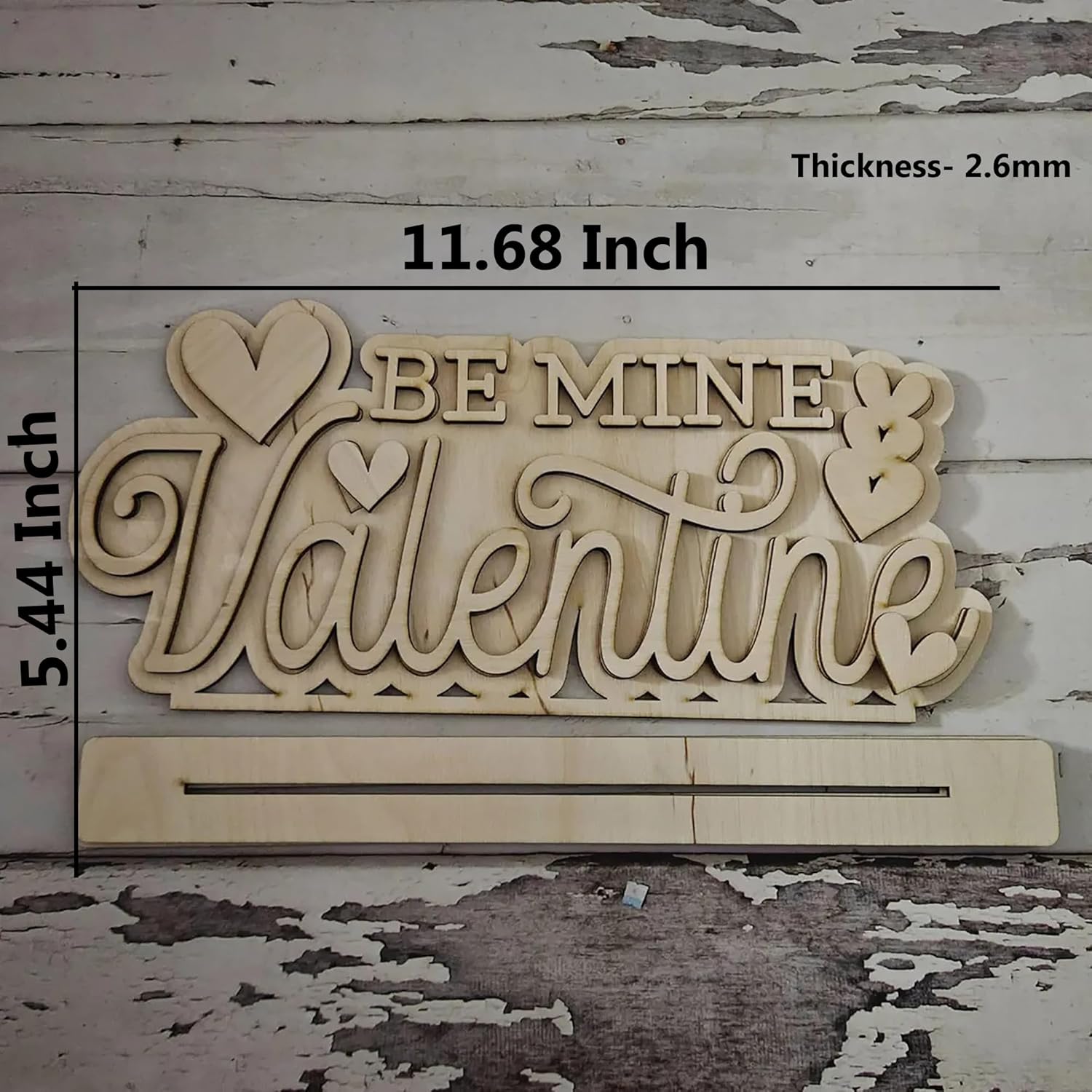 Wooden decorative sign with 'Be Mine Valentine' text on a rustic wooden background