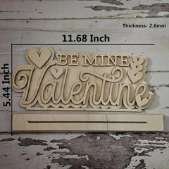Wooden decorative sign with 'Be Mine Valentine' text on a rustic wooden background