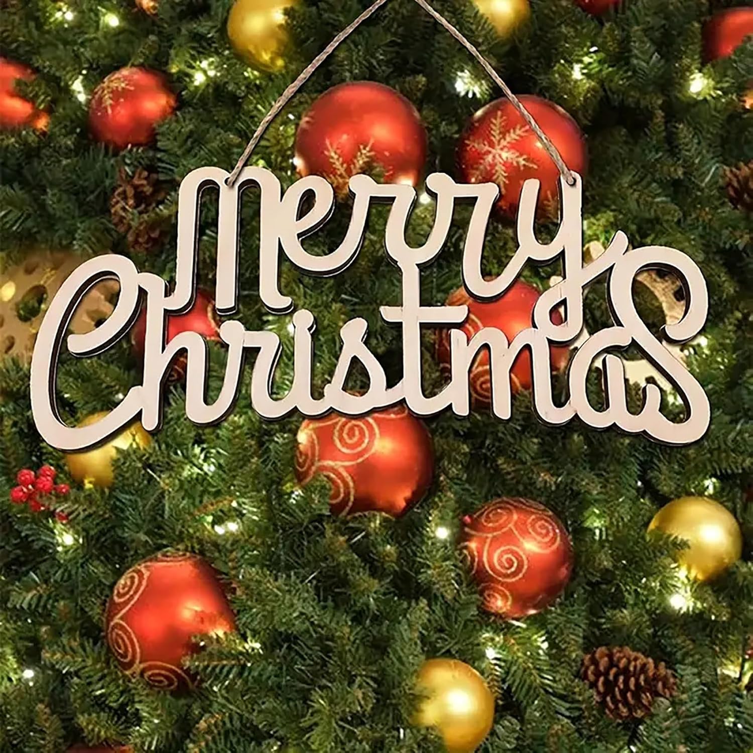 Decorative sign with 'Merry Christmas' on a Christmas tree with ornaments.