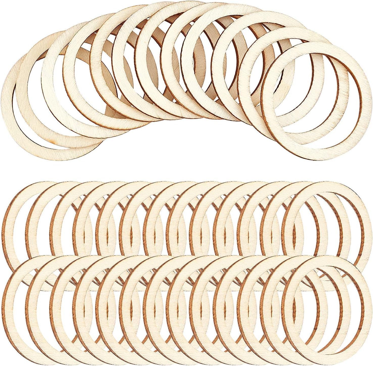 Multiple wooden rings stacked on a white background