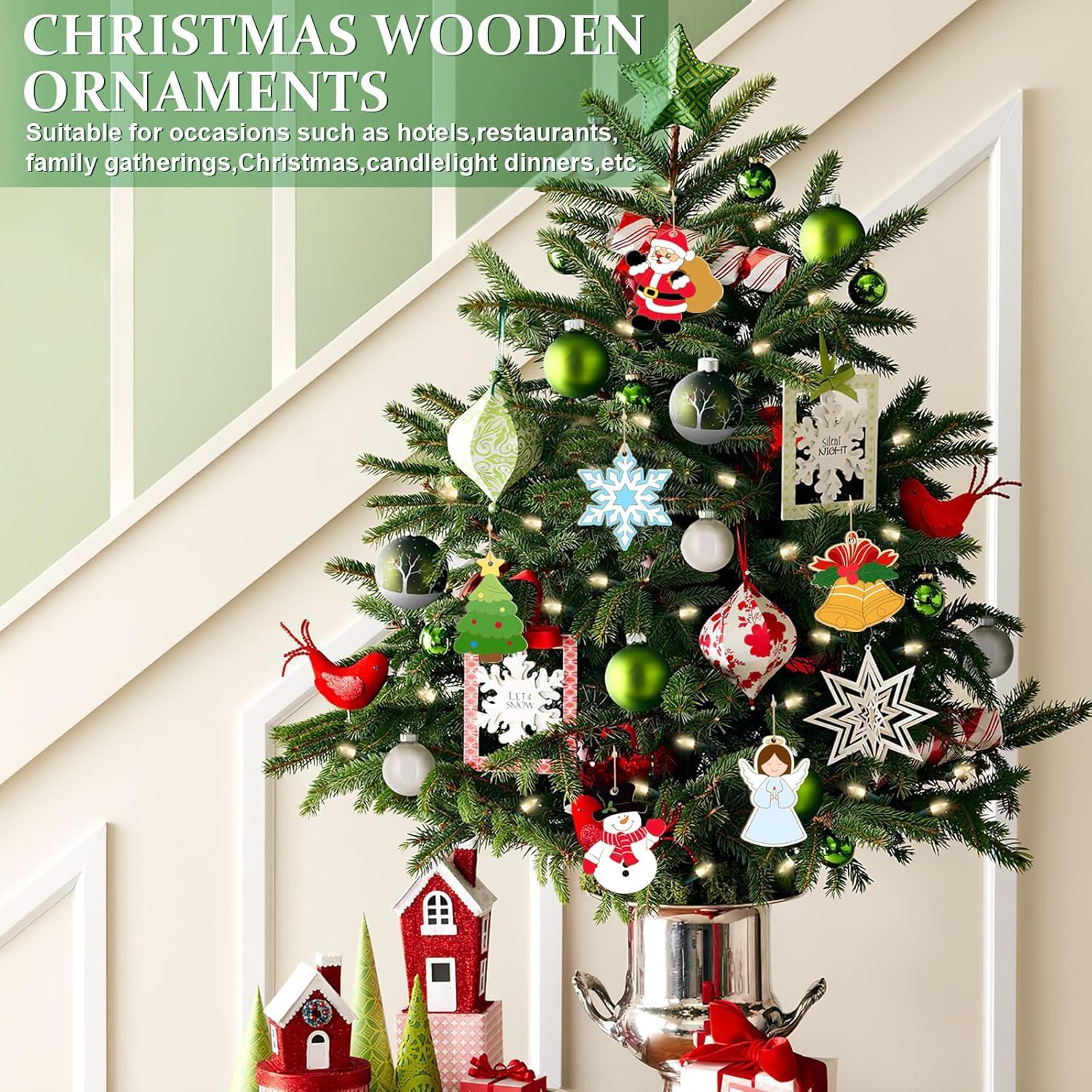 Decorative Christmas tree with various ornaments against a white wall.