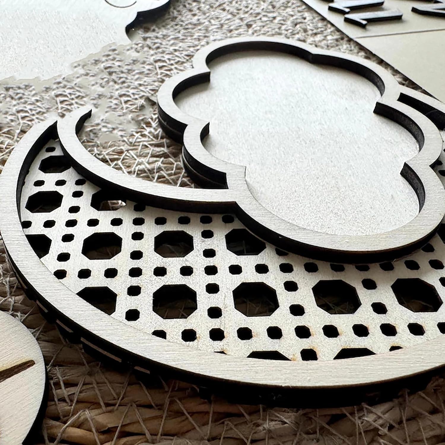 Wooden cutouts with geometric patterns on a textured surface