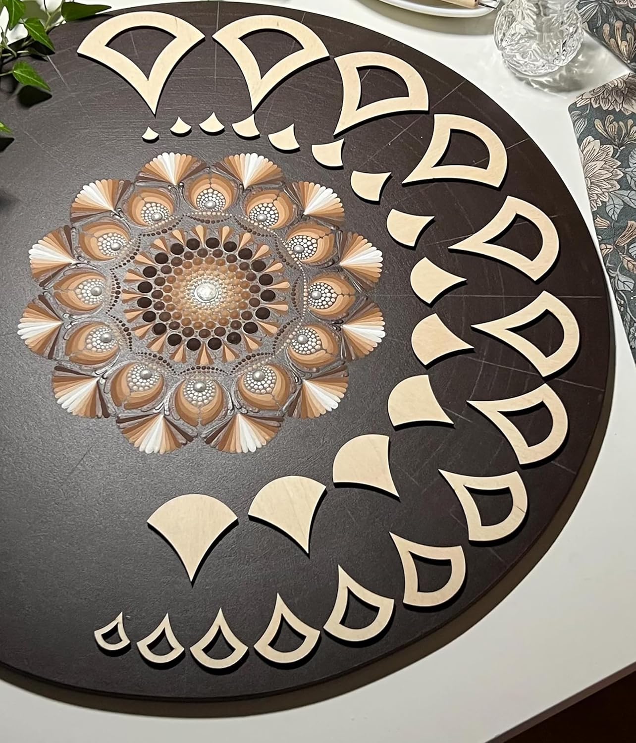Decorative round mat with geometric pattern on a table