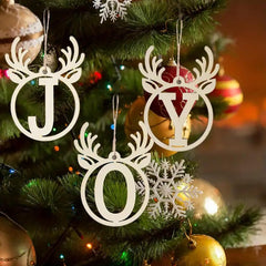 Decorative Christmas ornaments with 'JOY' on a Christmas tree.