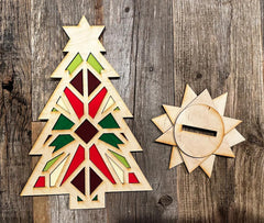 Wooden Christmas tree and star ornament on a wooden surface